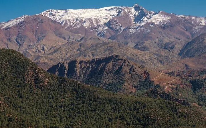 Atlas Mountains with snow-capped peaks and lush valleys near Marrakesh.