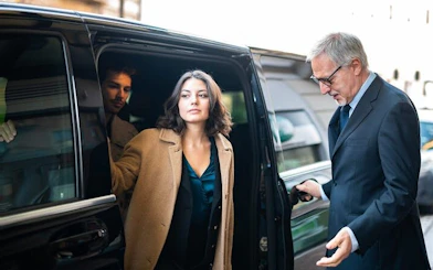 Passengers exiting a private car for transfer to Casablanca International Airport from Marrakech.
