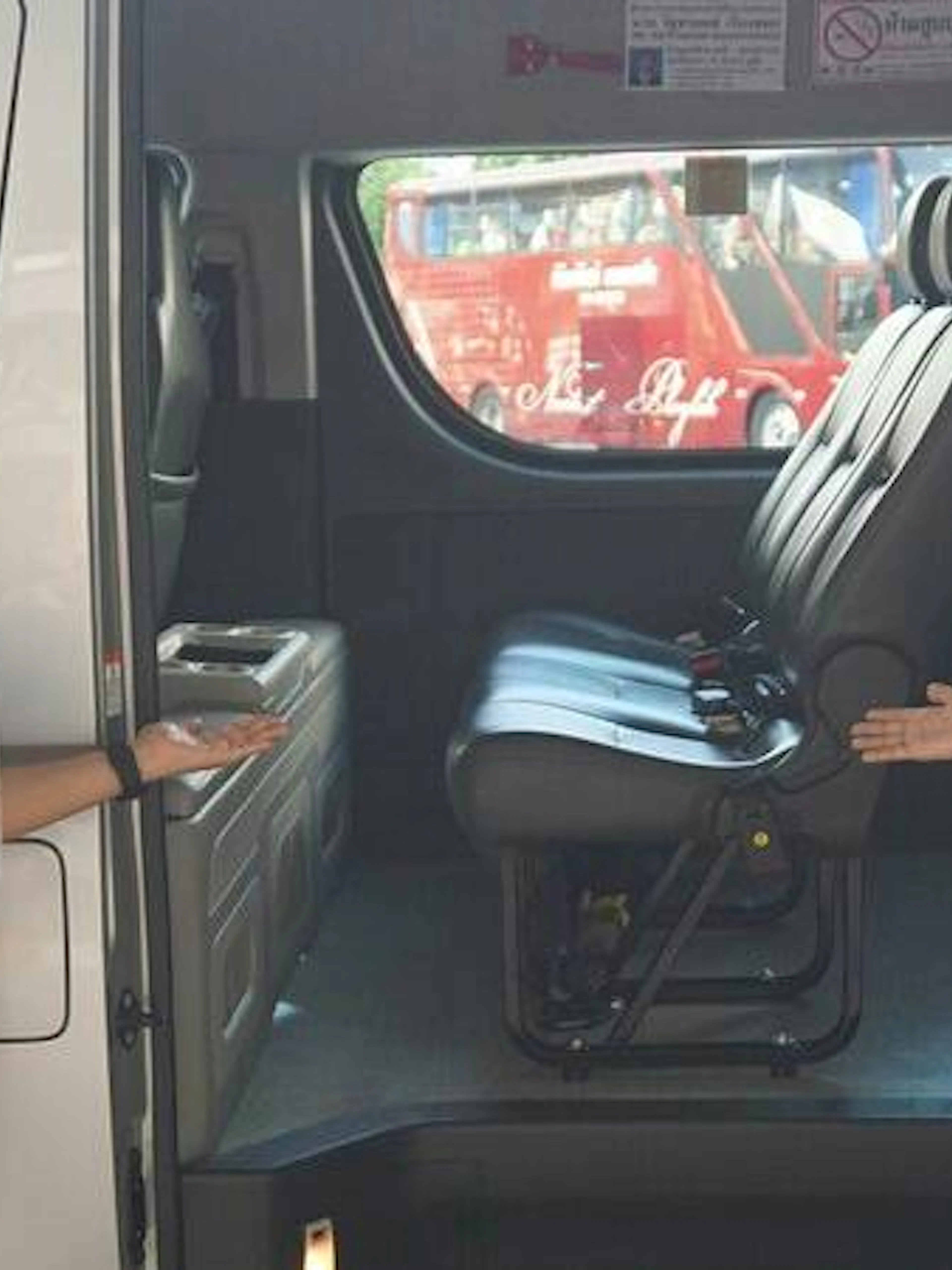 Phuket airport minivan transfer with staff showing vehicle interior for Khao Lak and Phang Nga hotels.