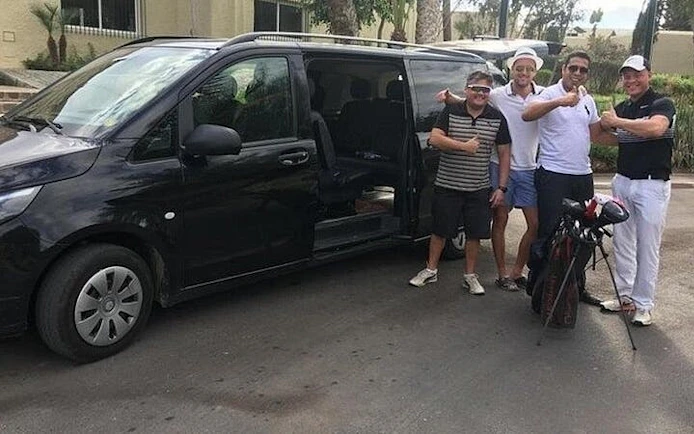 Minivan with passengers ready for private transfer from Marrakech to Casablanca Airport.
