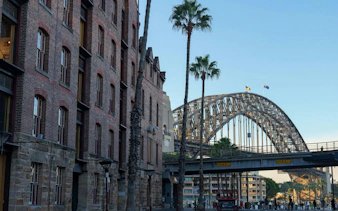 Historic buildings and Sydney Harbour Bridge on a self-guided audio walking tour from The Rocks to the Opera House.