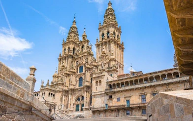 Santiago de Compostela Cathedral facade on a sunny day, part of self-guided walking tour.
