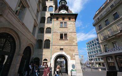 Clock tower in Geneva city center, part of the self-guided exploration game on virus epidemic history.