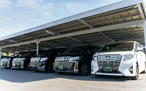 Luxury cars parked for Tokyo Night City Lights Private Car Tour.