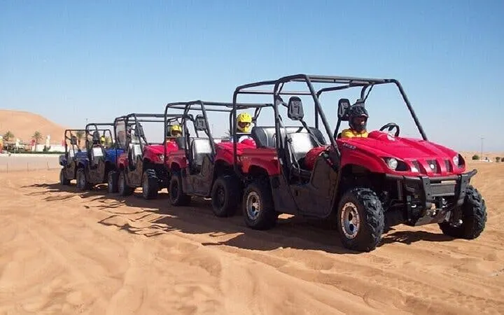 Family buggy cars lined up for desert safari in Sharm El Sheikh's Echo Valley.