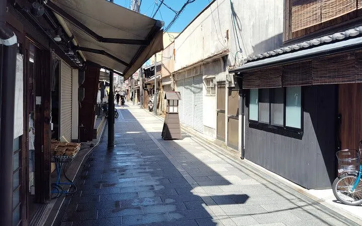 Kyoto street near Fushimi Sake Brewery, showcasing traditional architecture.