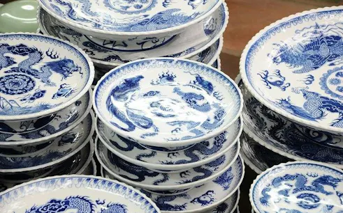 Ceramic plates with blue dragon designs at Bat Trang Village, Hanoi.