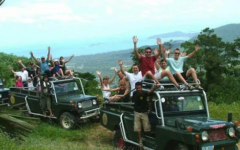 Tourists enjoying a 4WD Jeep safari with scenic views in Koh Samui, Thailand.