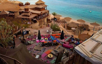 Luxurious seating area at Farsha Cafe overlooking the Red Sea in Sharm El Sheikh.