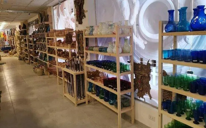 Shelves of colorful glassware and crafts in a Hurghada market shop.