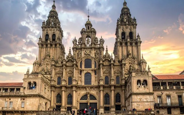 Santiago de Compostela Cathedral facade at sunset for self-guided walking tour app.