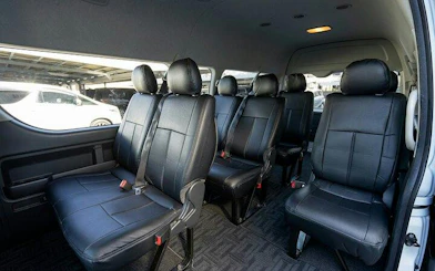 Private transfer van interior for Osaka City to Kansai Airport route.