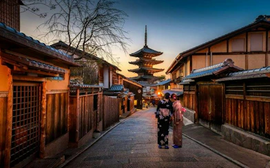 Pagoda and traditional street in Kyoto at dusk during private tour.