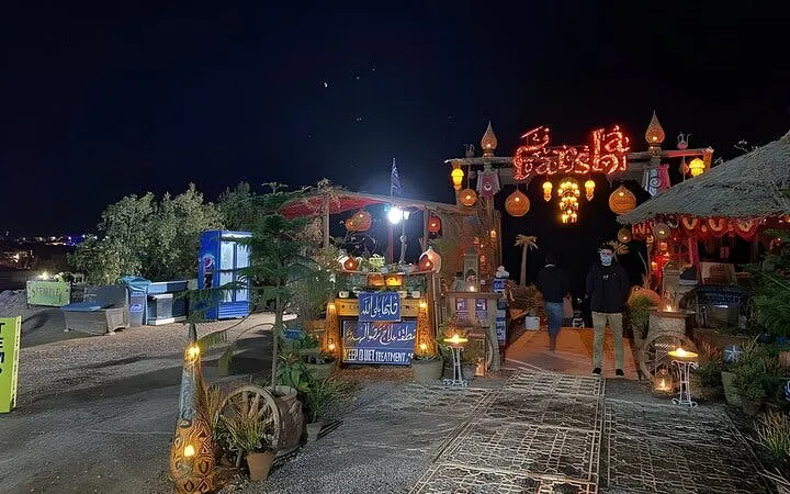Farsha Cafe entrance at night with decorative lights, Sharm El Sheikh.