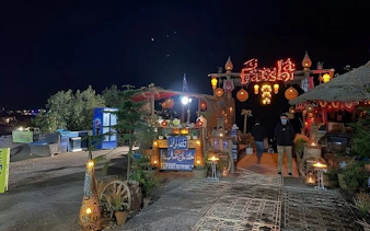 Farsha Cafe entrance at night with decorative lights, Sharm El Sheikh.