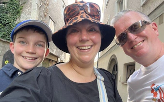 Family enjoying a self-guided city exploration game in Salzburg.