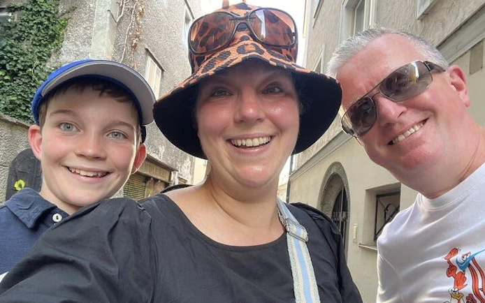 Family enjoying a self-guided city exploration game in Salzburg.