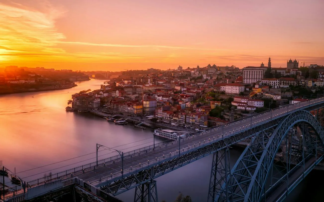 Sunset view of Porto Historic Center with Dom Luís I Bridge over Douro River, Porto.
