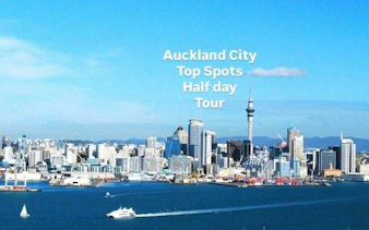 Auckland skyline with Sky Tower and harbor, featured in a small group half-day tour.