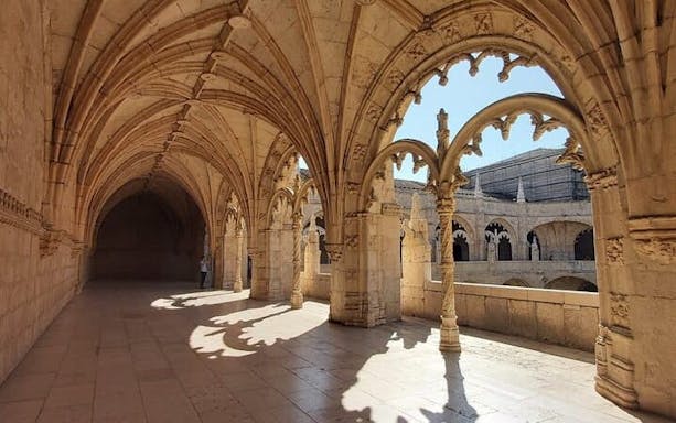 Cloister arches inside Jeronimos Monastery, Lisbon, Portugal.