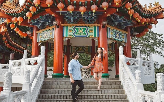 Couple exploring Thean Hou Temple in Kuala Lumpur during Batu Caves tour.