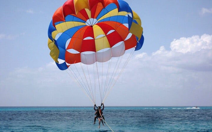 Parasailing over the Red Sea with colorful parachute, Hurghada.