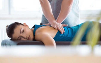 Person receiving a back massage during Turkish Bath experience in Sharm El Sheikh.