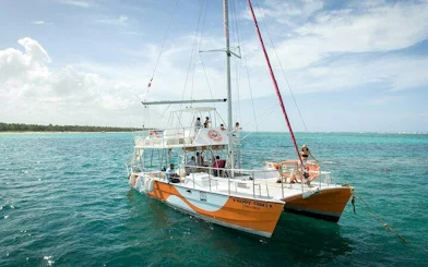 Catamaran on turquoise waters during Punta Cana snorkeling tour.
