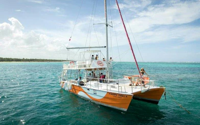 Catamaran on turquoise waters during Punta Cana snorkeling tour.