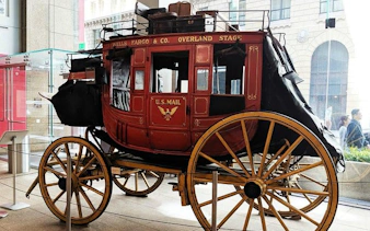 Historic Wells Fargo stagecoach on display in San Francisco museum for Gold Rush exploration game.