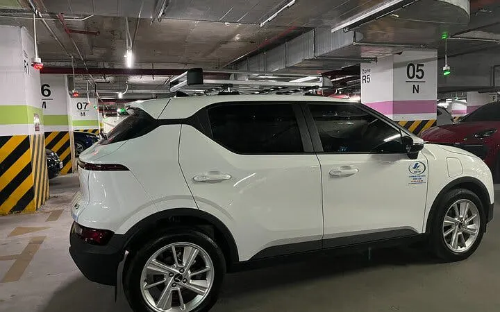 Private transfer vehicle in parking garage for Sapa to Lào Cai Train Station service.