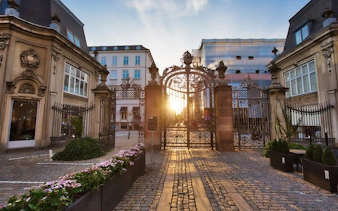 Copenhagen city gate with sunset view, part of Little Mermaid self-guided exploration game.