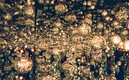 teamLab Bio-Vortex installation with reflective orbs in Kyoto exhibition.