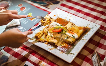 Traditional Hungarian dish served on a checkered tablecloth during Budapest food tour.