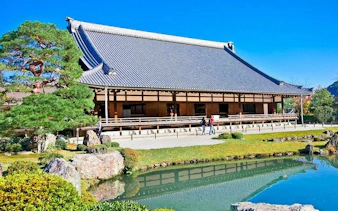 Arashiyama temple with traditional architecture and garden pond, Kyoto.
