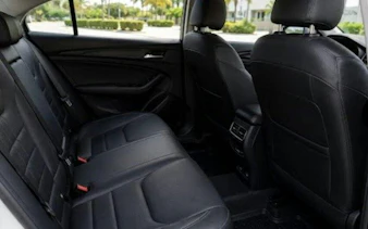 Backseat view of a private transfer vehicle for Puerto Morelos to Cancun Airport, Riviera Maya.