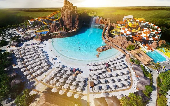 Aerial view of The Land of Legends Theme Park's water park with pools, slides, and sun loungers.