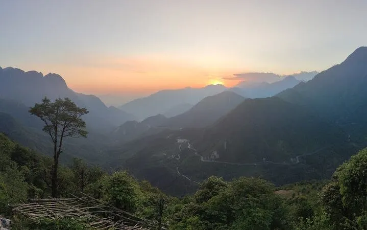Sunset view over mountains and valleys in Sa Pa, featuring the Lonely Tree.