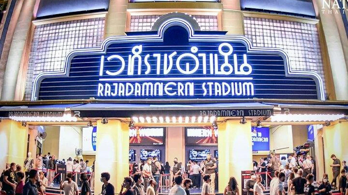 Rajadamnern Stadium entrance with crowd, Bangkok Muay Thai event.