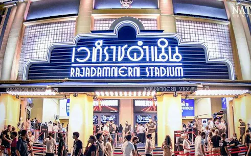 Rajadamnern Stadium entrance with crowd, Bangkok Muay Thai event.