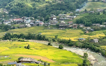 Sapa rice terraces and village view with river, Vietnam trekking tour.