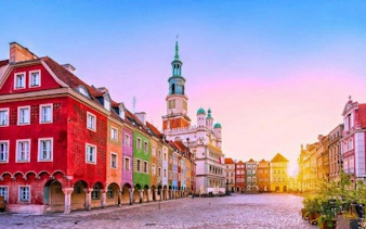 Colorful buildings in Poznan Old Market Square during sunset, featured in a self-guided audio tour.