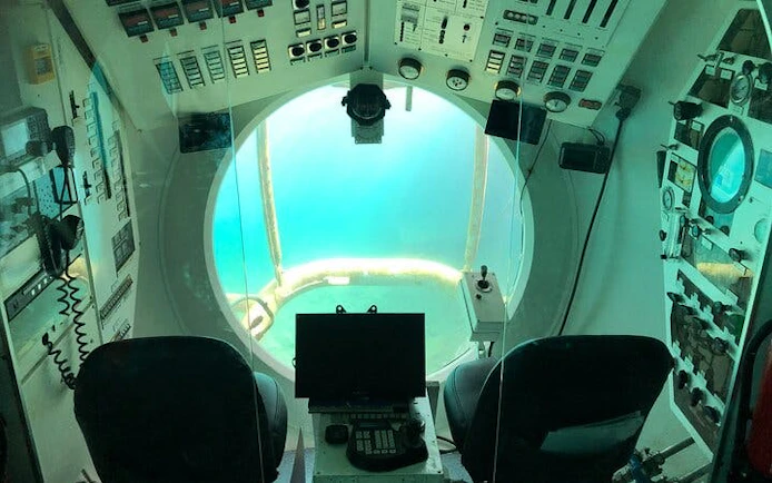 Submarine interior with control panels and large viewing window, Tenerife tour.