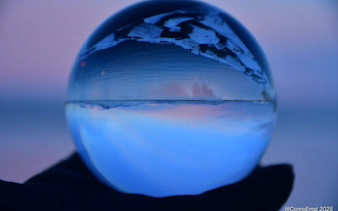 Reykjavik skyline reflected in a glass sphere during a guided walking tour.
