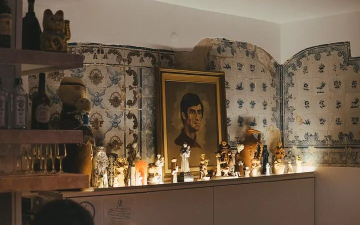 Fado venue interior with traditional Portuguese tiles and decorative items at Mesa de Frades.
