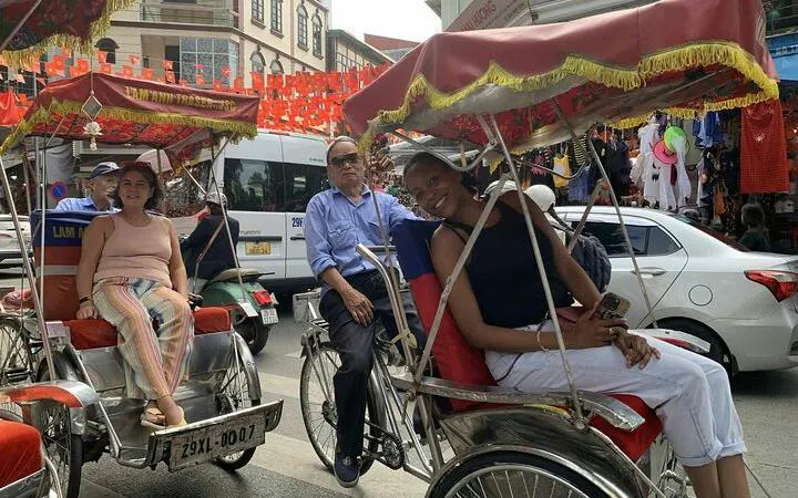 Cyclo riders in Hanoi's Old Quarter near Train Street.