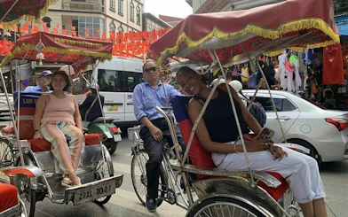 Cyclo riders in Hanoi's Old Quarter near Train Street.