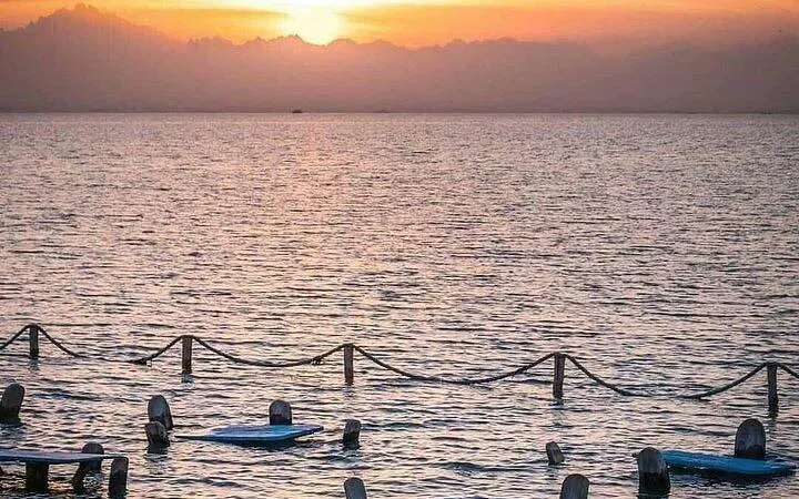 Sunset view over the sea with floating platforms, Orange Bay, Hurghada.
