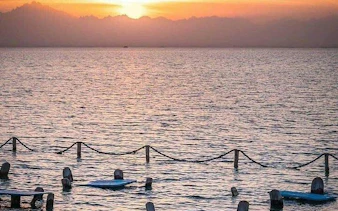 Sunset view over the sea with floating platforms, Orange Bay, Hurghada.
