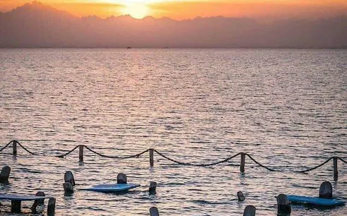 Sunset view over the sea with floating platforms, Orange Bay, Hurghada.